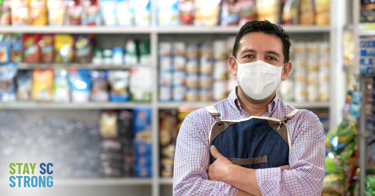 Male grocery worker wearing mask graphic